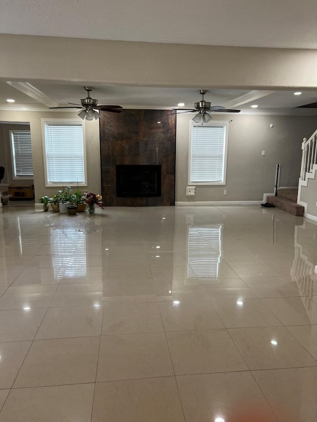 1506 Grand Valley Dr, Houston, TX 77090 - unfurnished living room featuring a tile fireplace, tile patterned floors, stairway, a ceiling fan, and baseboards