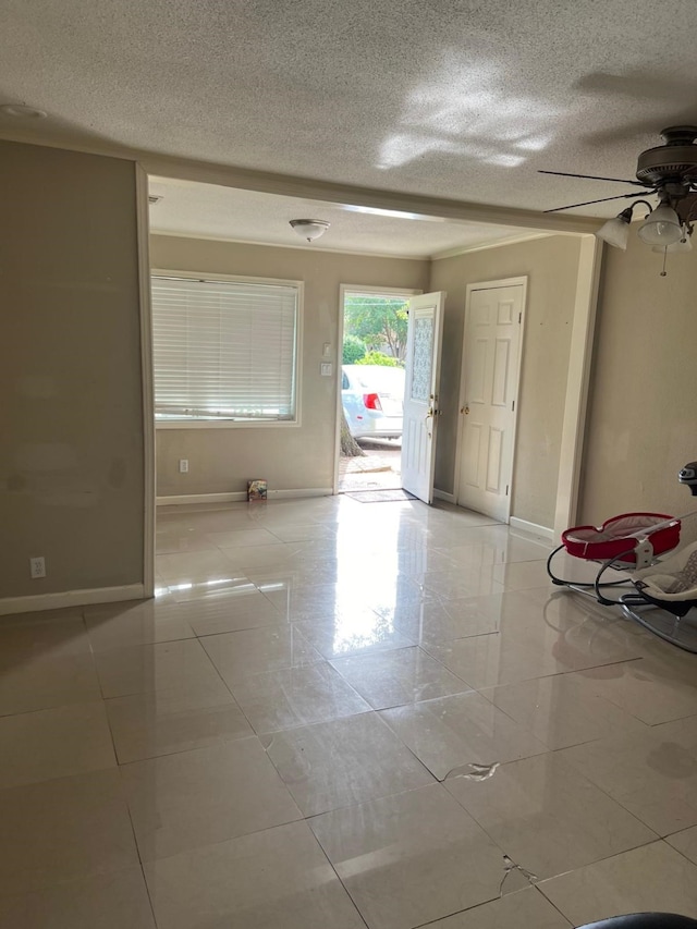 1506 Grand Valley Dr, Houston, TX 77090 - empty room with a textured ceiling, a ceiling fan, and baseboards