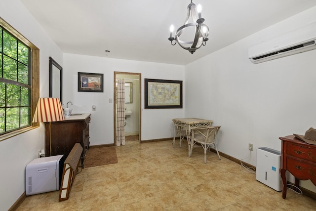 23025 Jane Rd, Tomball, TX 77377 - office featuring light floors, a chandelier, a wall mounted AC, baseboards, and a sink