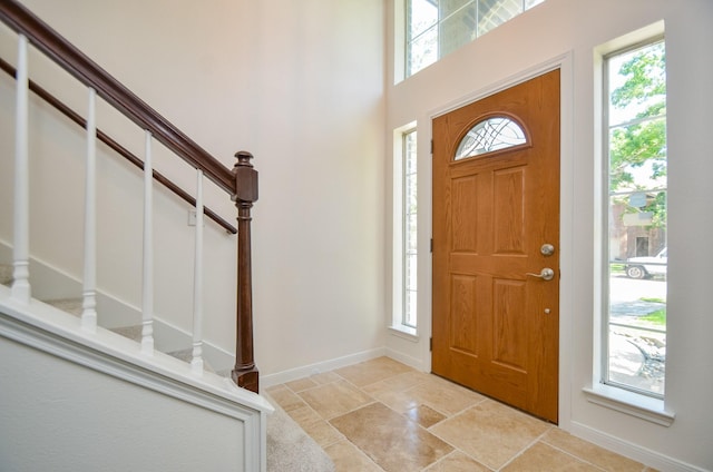 13523 Spring Ct, Tomball, TX 77375 - foyer entrance featuring healthy amount of natural light, stairs, and baseboards