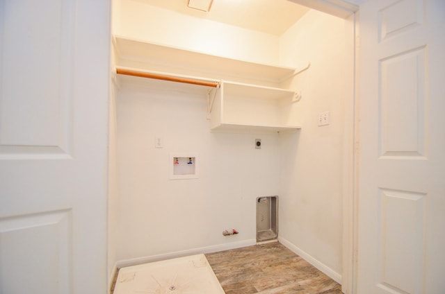 13523 Spring Ct, Tomball, TX 77375 - clothes washing area featuring gas dryer hookup, hookup for a washing machine, light wood-style floors, baseboards, and hookup for an electric dryer