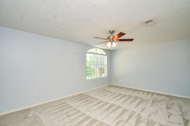 13523 Spring Ct, Tomball, TX 77375 - spare room featuring ceiling fan, light colored carpet, and baseboards