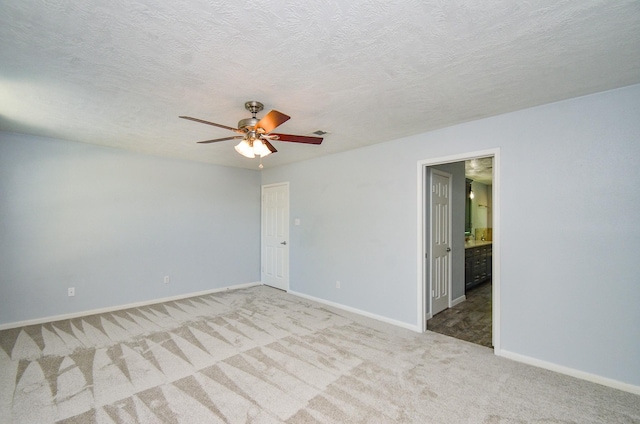 13523 Spring Ct, Tomball, TX 77375 - carpeted spare room featuring a ceiling fan and baseboards