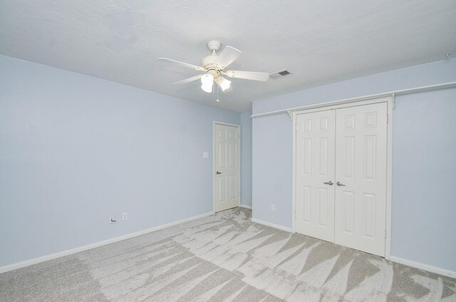 13523 Spring Ct, Tomball, TX 77375 - unfurnished bedroom featuring light colored carpet, a closet, baseboards, and ceiling fan