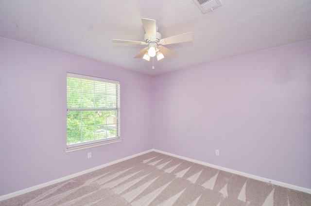 13523 Spring Ct, Tomball, TX 77375 - empty room with light colored carpet, baseboards, and ceiling fan