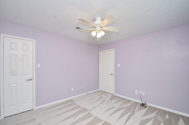 13523 Spring Ct, Tomball, TX 77375 - empty room featuring baseboards, light colored carpet, and a ceiling fan
