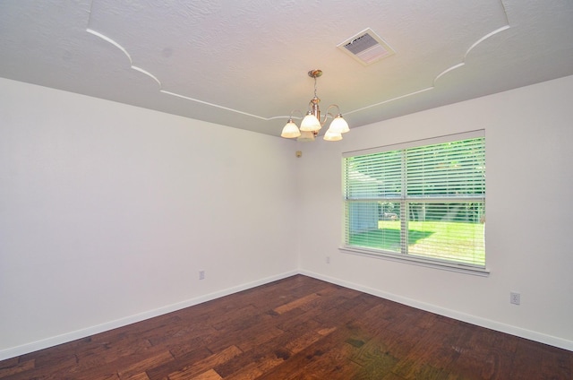 13523 Spring Ct, Tomball, TX 77375 - unfurnished room with a chandelier, wood finished floors, baseboards, and a textured ceiling