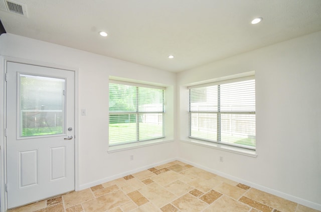 13523 Spring Ct, Tomball, TX 77375 - foyer with light stone finish floors, baseboards, and recessed lighting
