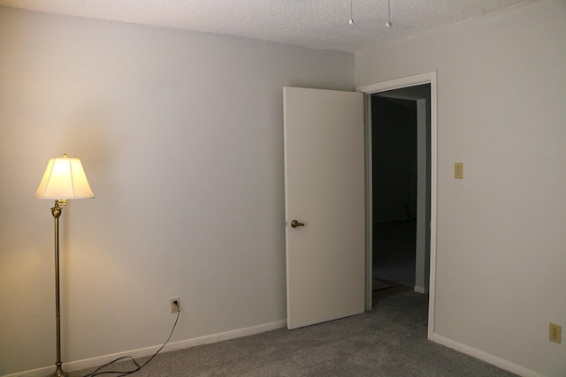 9922 Hibernia Dr, Houston, TX 77088 - spare room with carpet floors, baseboards, and a textured ceiling