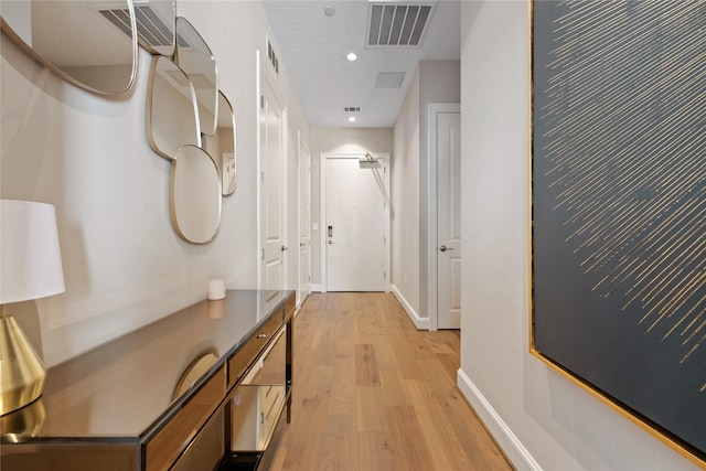 1211 Caroline St Unit 908, Houston, TX 77002 - corridor with light wood-type flooring, baseboards, and recessed lighting
