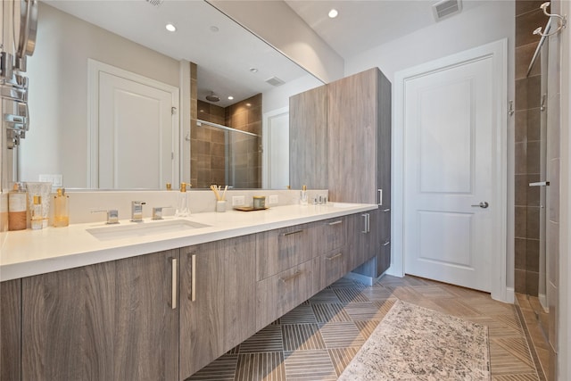 1211 Caroline St Unit 908, Houston, TX 77002 - full bathroom featuring a shower stall, double vanity, and recessed lighting