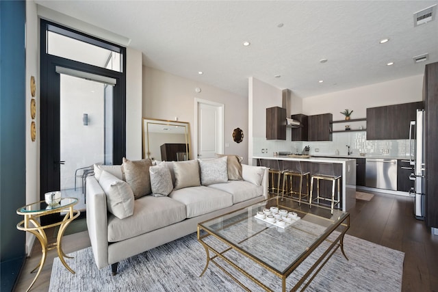 1211 Caroline St Unit 908, Houston, TX 77002 - living room with dark wood-type flooring, recessed lighting, and plenty of natural light