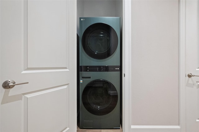 1211 Caroline St Unit 908, Houston, TX 77002 - washroom with stacked washing machine and dryer