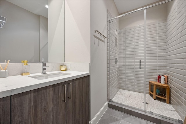 1211 Caroline St Unit 908, Houston, TX 77002 - bathroom with a stall shower, vanity, and tile patterned floors