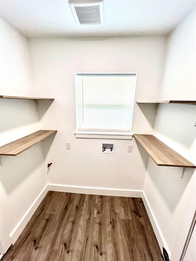 803 Hackberry St, Stafford, TX 77477 - laundry room with baseboards, hookup for a washing machine, and wood finished floors