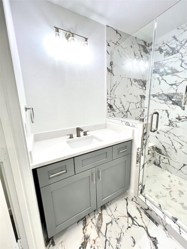 803 Hackberry St, Stafford, TX 77477 - full bath featuring marble look tile flooring, vanity, and a marble finish shower