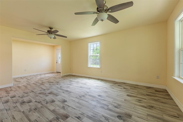 1535 Scott St, La Marque, TX 77568 - spare room with wood finished floors, ceiling fan, and baseboards