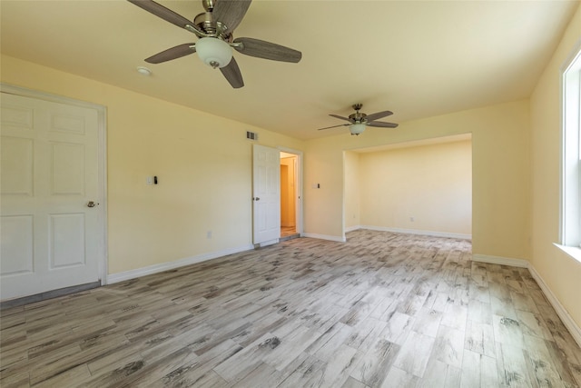 1535 Scott St, La Marque, TX 77568 - unfurnished room featuring light wood-style flooring, a ceiling fan, and baseboards