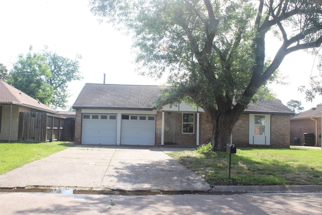 814 Kilpatrick St, Channelview, TX 77530 - ranch-style house with a garage, concrete driveway, brick siding, and a shingled roof