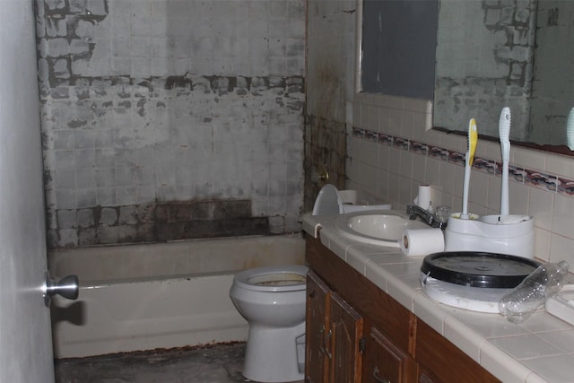 814 Kilpatrick St, Channelview, TX 77530 - bathroom featuring tasteful backsplash, tile walls, vanity, toilet, and concrete flooring