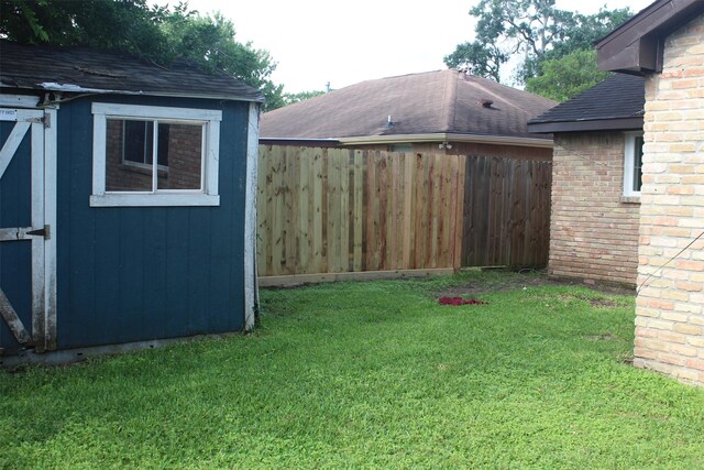 814 Kilpatrick St, Channelview, TX 77530 - view of yard featuring an outdoor structure and a storage unit