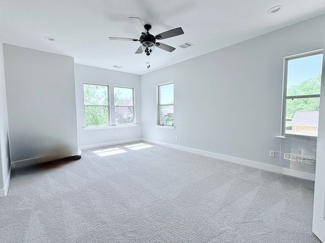 55 Ruskin Dr W, Montgomery, TX 77356 - spare room with baseboards, ceiling fan, and carpet floors