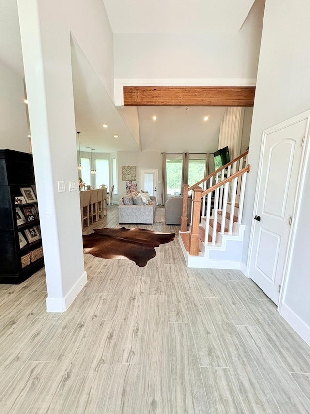 55 Ruskin Dr W, Montgomery, TX 77356 - entrance foyer featuring stairway, wood finished floors, baseboards, beamed ceiling, and recessed lighting