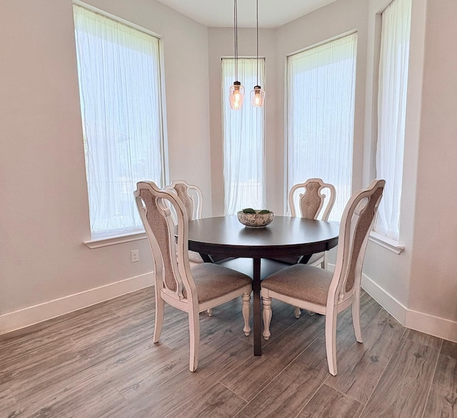 55 Ruskin Dr W, Montgomery, TX 77356 - dining room with baseboards and light wood finished floors
