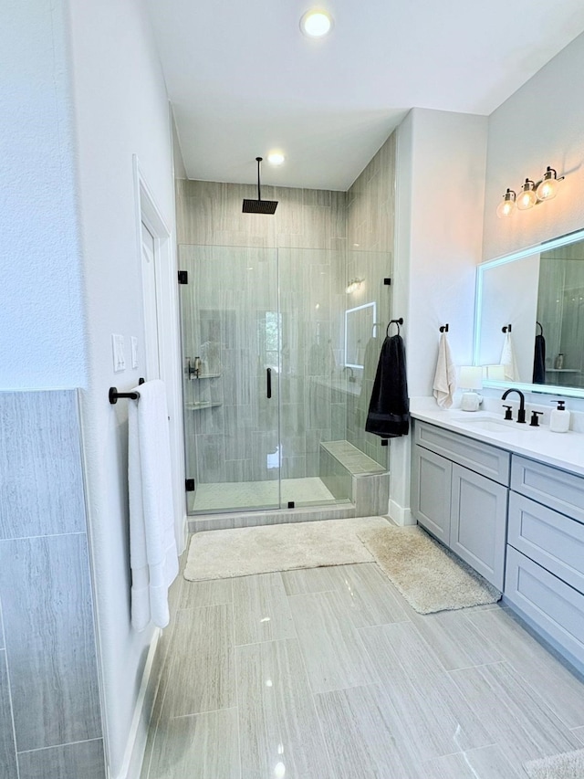 55 Ruskin Dr W, Montgomery, TX 77356 - bathroom featuring a shower stall, vanity, and baseboards
