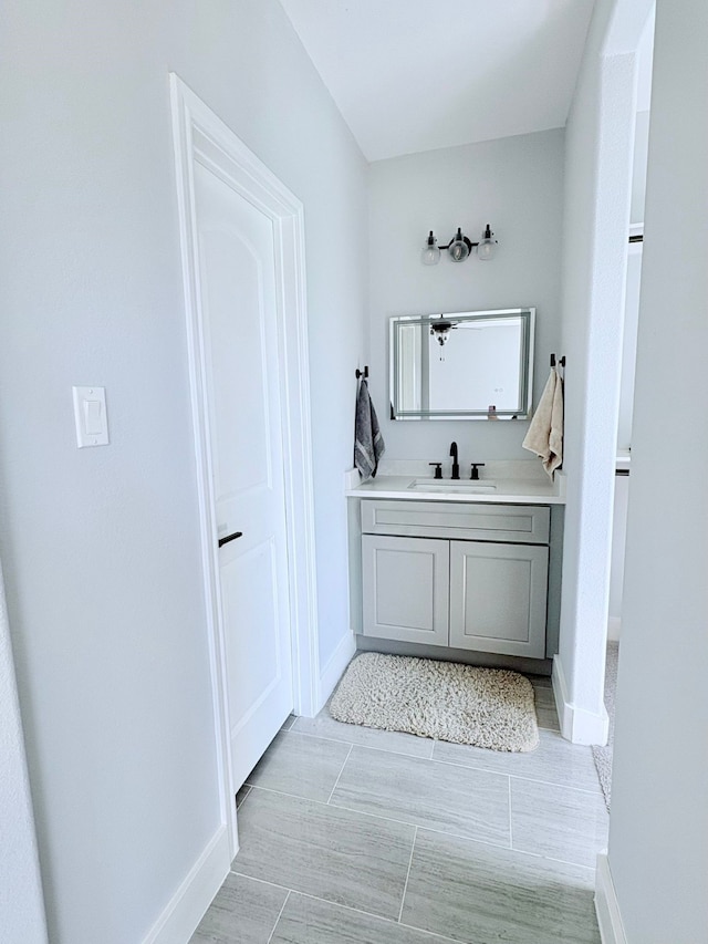 55 Ruskin Dr W, Montgomery, TX 77356 - bathroom featuring baseboards and vanity