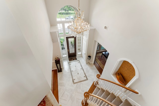 6510 Hoads Deuce Ct, Spring, TX 77379 - foyer entrance with a towering ceiling, a chandelier, stairs, and baseboards