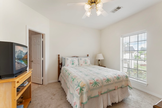 6510 Hoads Deuce Ct, Spring, TX 77379 - bedroom with light colored carpet, baseboards, and a ceiling fan