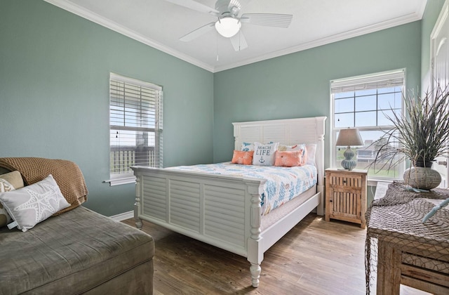 1109 Pompano Dr, Crystal Beach, TX 77650 - bedroom with crown molding, wood finished floors, baseboards, and a ceiling fan