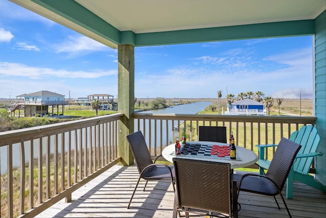 1109 Pompano Dr, Crystal Beach, TX 77650 - deck with a water view and outdoor dining space