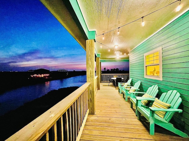 1109 Pompano Dr, Crystal Beach, TX 77650 - deck at dusk with a water view