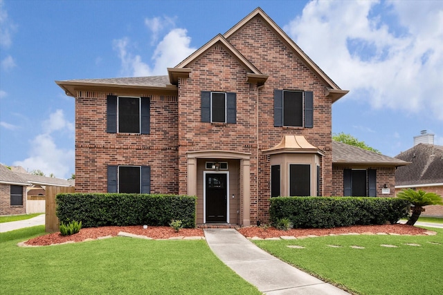 12814 Prestige Row, Houston, TX 77065 - traditional-style home with brick siding, a front yard, and a shingled roof