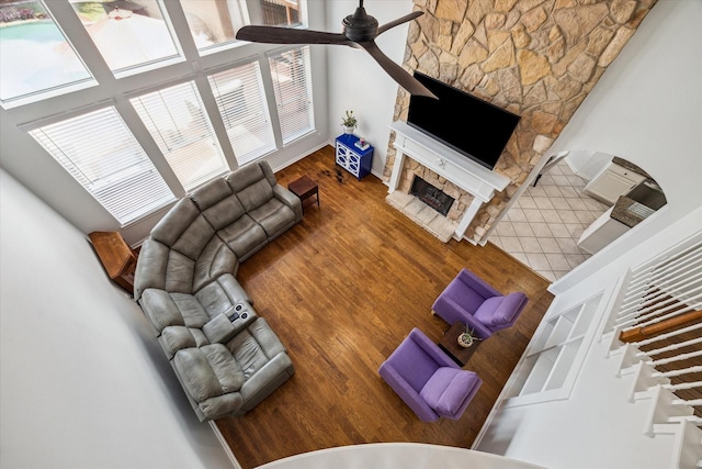 12814 Prestige Row, Houston, TX 77065 - living room with ceiling fan, wood finished floors, and a stone fireplace
