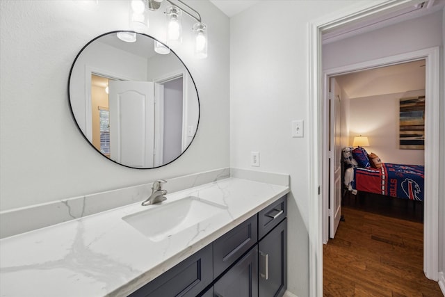 12814 Prestige Row, Houston, TX 77065 - ensuite bathroom featuring wood finished floors and vanity