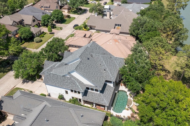 aerial view of residential area featuring a pool area