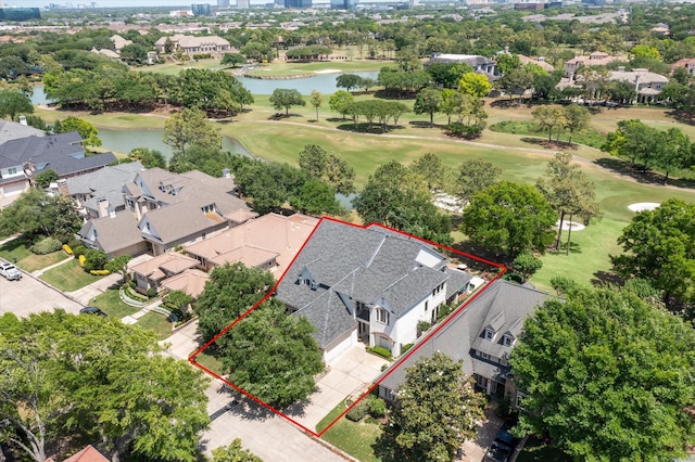 aerial perspective of suburban area with a golf course, a large body of water, and property parcel outlined