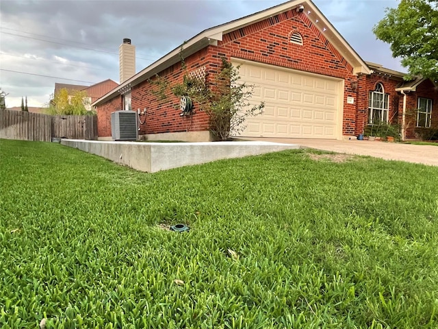 view of side of home featuring a garage, central air condition unit, and brick siding