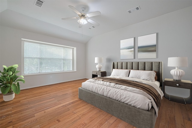 10210 Squirehill Ct, Houston, TX 77070 - bedroom with wood finished floors, vaulted ceiling, baseboards, and ceiling fan