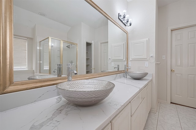 10210 Squirehill Ct, Houston, TX 77070 - bathroom featuring marble finish floors, a shower stall, and double vanity