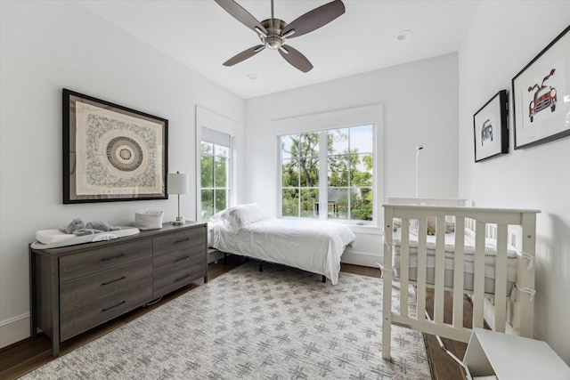 2224 N Blvd, Houston, TX 77098 - bedroom with wood finished floors, ceiling fan, and baseboards