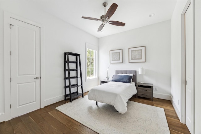 2224 N Blvd, Houston, TX 77098 - bedroom with dark wood finished floors, baseboards, and a ceiling fan
