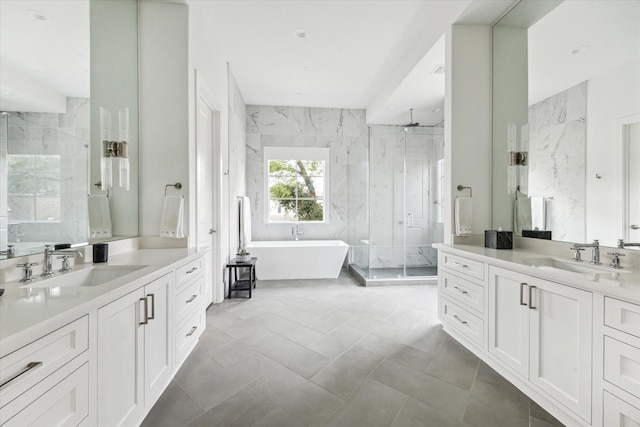 2224 N Blvd, Houston, TX 77098 - full bath featuring a shower stall, a freestanding bath, two vanities, and tile walls