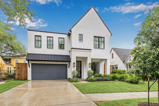 2224 N Blvd, Houston, TX 77098 - view of front of house with brick siding, a garage, driveway, and a standing seam roof