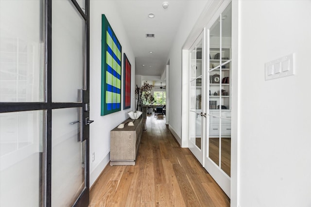 2224 N Blvd, Houston, TX 77098 - hall with french doors, light wood-type flooring, baseboards, and recessed lighting