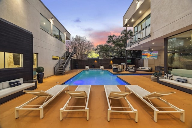 4002 Chatham Ln, Houston, TX 77027 - view of swimming pool with outdoor lounge area, stairs, a fenced backyard, and a patio