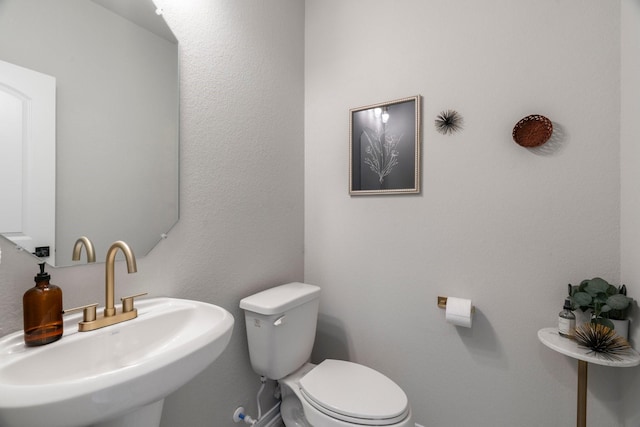 13110 Mid Stocket Dr, Humble, TX 77346 - half bath featuring a sink and toilet